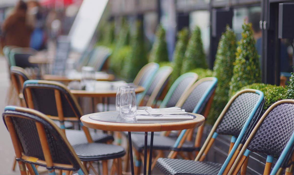 empty dining chairs outside a restaurant