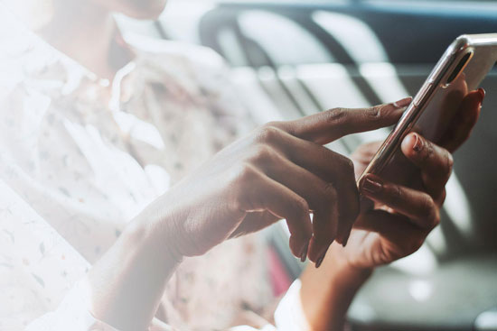 girl touching mobile phone screen