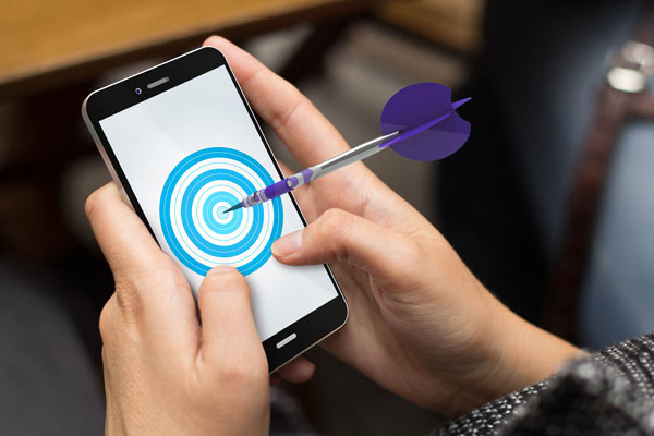 dart hitting bullseye on mobile phone