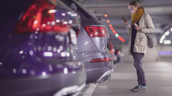 girl on phone in parking garage