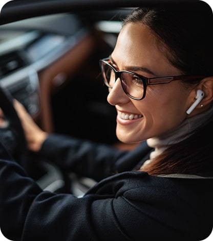 Woman on phone parking happy
