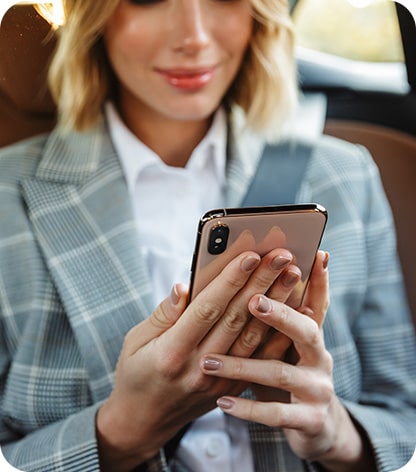 Woman on phone parking happy